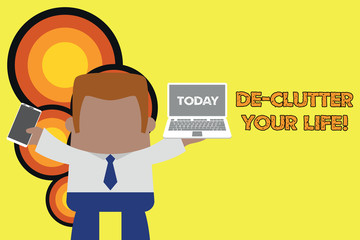 Handwriting text De Clutter Your Life. Conceptual photo remove unnecessary items from untidy or overcrowded places Standing professional man tie holding left open laptop right mobile phone