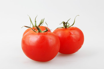Close-Up Of Red Tomato On White Background