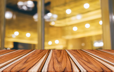 Selective Empty wooden table in front of abstract blurred festive light background with light spots and bokeh for product montage display of product