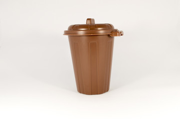 Closed small trash can on a white background.