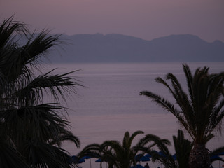 Beautiful pink sunset sea view in greek island