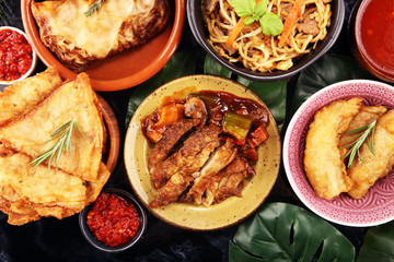 Assorted Chinese food set. Chinese noodles, fried rice, peking duck, dim sum, spring rolls. Famous Chinese cuisine dishes on table. Chinese restaurant