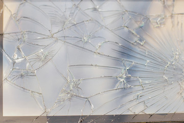 Texture from the broken phone screen. The smartphone with the burst glass