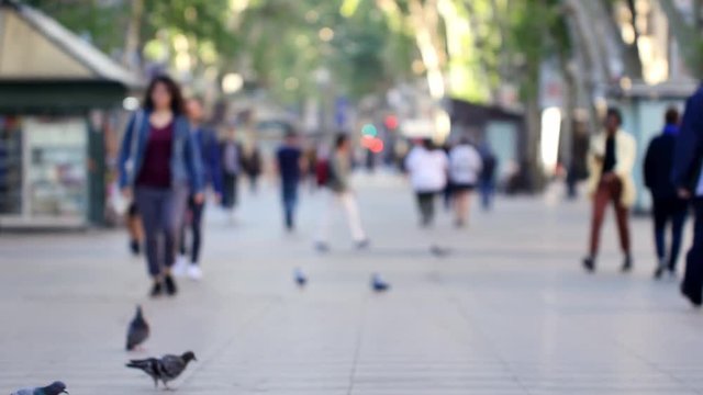 Unrecognizable peoble on the Rambla street in Barcelona