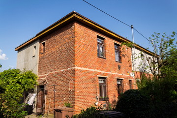 Typified red brick family Bata houses in Zlin, Moravia, Czech Republic, sunny summer day, street view