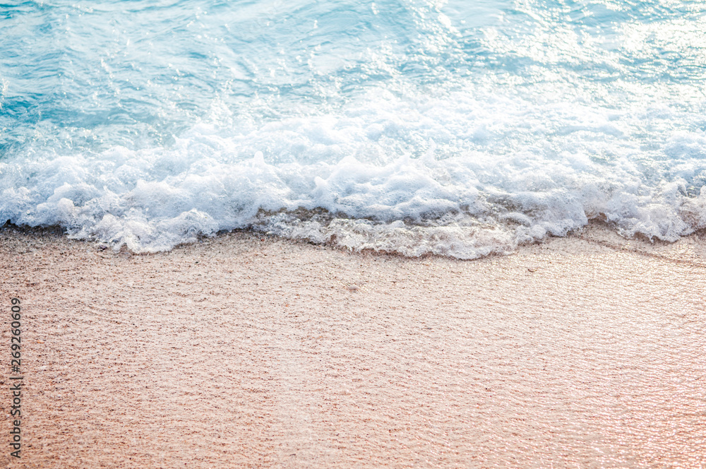 Wall mural soft wave of blue ocean on sandy beach