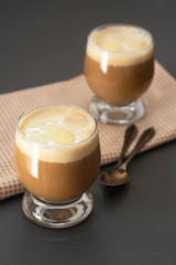 Coffee cold drink with vanilla ice cream and espresso. Deliciouse summer refreshing drink in glass.