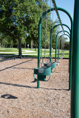 empty swings in a playground