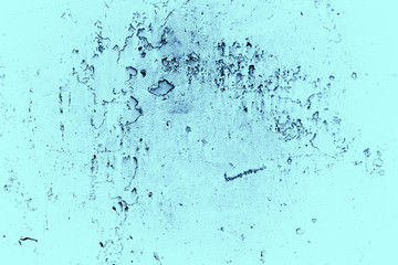 Vintage blue background. Rough painted wall of sapphire color. Imperfect plane of blue colored. Uneven old decorative toned backdrop of cyan tint. Texture of sapphirine hue. Ornamental stony surface.