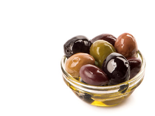 Bowl of different types of olives and olive oil