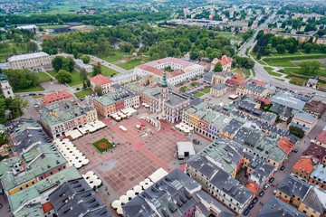 Aerial drone view on Zamosc old town and city main square with town hall - obrazy, fototapety, plakaty