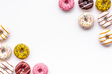 Traditional american donuts of different flavors on white background flat lay mockup