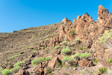 Fototapeta premium Igneous rock formation on the long distance trail from the Valle Gran Rey to the village Arure. 850m up on serpentine to the La Merica plateau on top of the mountain