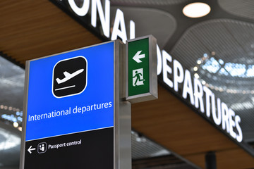 Sign of International departures in airport. Concept of Late for flight.