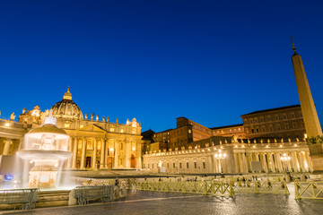 Naklejka premium Architecture of the St. Peter's Square and Basilica illuminated at dusk, Vatican City