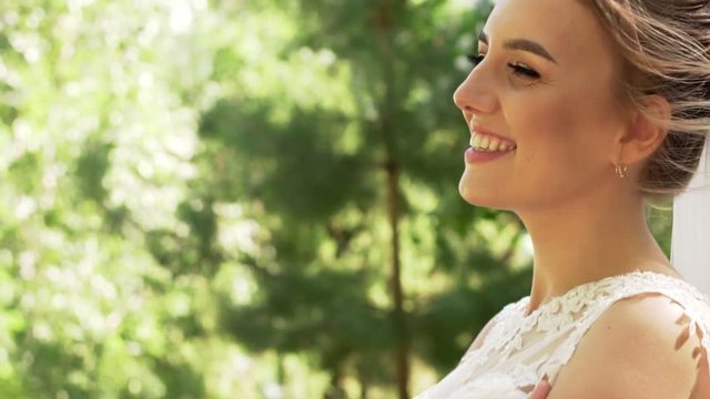 Side View Of A Beautiful Young Positive Girl Bride