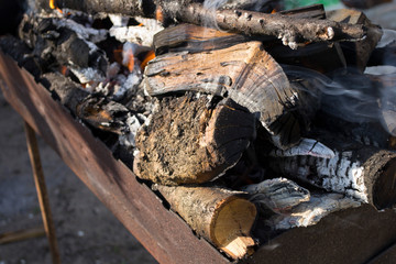 burning wood in the iron grill
