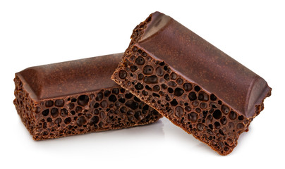 porous chocolate pieces isolated on white background