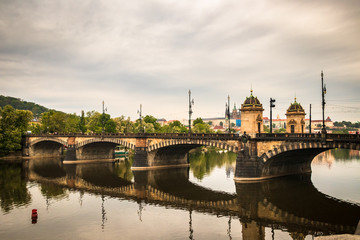 Beautiful Vltava river in Prague with old town and historical buildings in the background