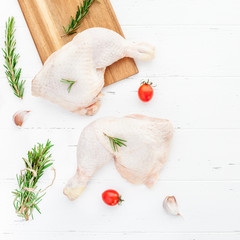 Fresh raw chicken legs with herbs. Cooking concept
