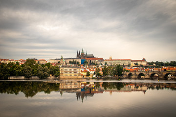 Beautiful Vltava river in Prague with old town and historical buildings in the background
