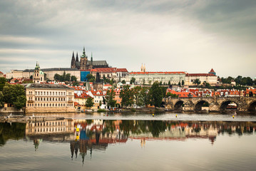 Beautiful Vltava river in Prague with old town and historical buildings in the background