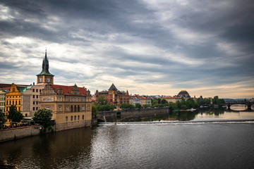 Fototapeta na wymiar Beautiful Vltava river in Prague with old town and historical buildings in the background