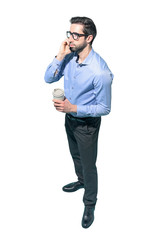 Man having a coffee break and talking on the phone