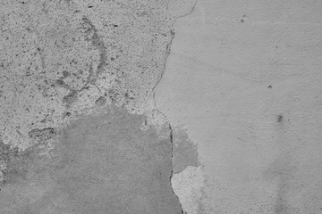 grauer Hintergrund, graue Betonwand, Textur, Strukturierte Wand im Industrial Style. Raue gebrochene und rissige Wand in Grau.