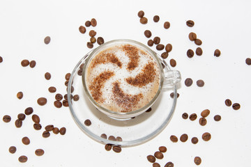 Cappuccino coffee with pattern of cinnamon isolated on white background. Coffee with milk. . Coffee beans
