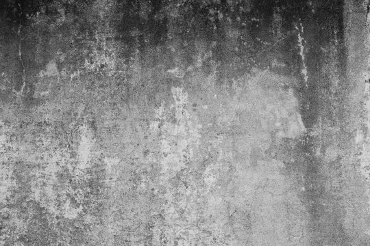 Alte verdreckte Wand mit groben und verschmutzen Strukturen und rissen. Hintergrund im Grunge Stil. Betonwand im Industrial Design.