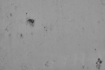 Graue Betonmauer, Grauer Hintergrund, Grau Struktur mit groben und zerkratzen Stzrukturen im Indiustrial Design. Graue Steinmauer als Hintergrund und gestalterisches Element.