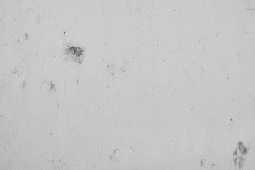 Grauer Hintergrund, Betonwand in Grau im Industrial Style. Grau Textur mit rissigen und rauen Strukturen und Beschädigungen.