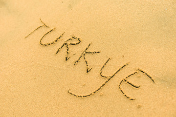 Word turkey with heart on sand beach in the summer on vacation inspire to travel.  Romantic travel for love couples or family holidays. resort countries and cities for tourists. Relaxing sign on sand