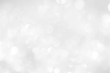 A brilliant white background with circles and ovals. Template for a holiday card with bright and sparkling lights.