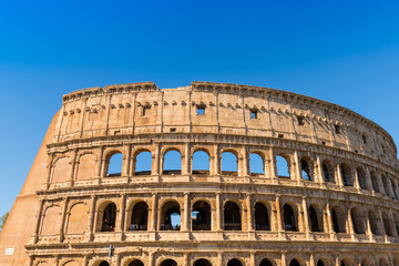 The Colosseum in Rome with blue sky, Italy 