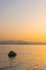 Sunset behind the Cyclades in the Aegean Sea, Naxos, Greece