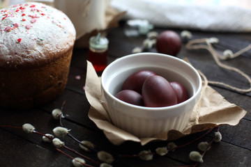 Easter still life with cake on a dark wooden background