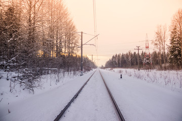 Russian railway in winter. Snow railway. Rails and sleepers.