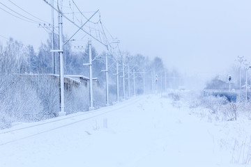 Russian railway in winter. Snow railway. Rails and sleepers.