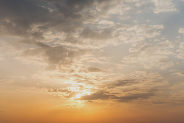Fototapeta na wymiar sunlight from sunset illuminates the cloudy sky