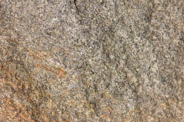 Background of granite. Texture of granite stone. Pattern of roughened surface. Texture of brown...