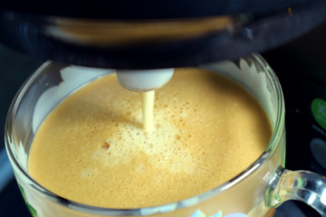 Making fresh coffee with foam with a coffee maker