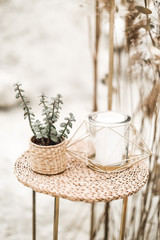 rustic, eco and boho wedding in the desert canyon with decor. Candles, succulents, golden stands, decorations in rustic style