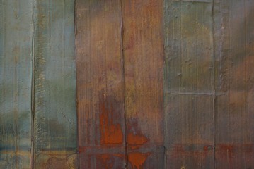 gray brown metal texture from old rusty iron wall with seams
