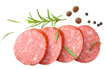 sliced sausage salami with rosemary and peppercorns isolated on white background. top view
