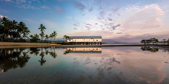 Building by beach at sunset in Port Douglas, Australia