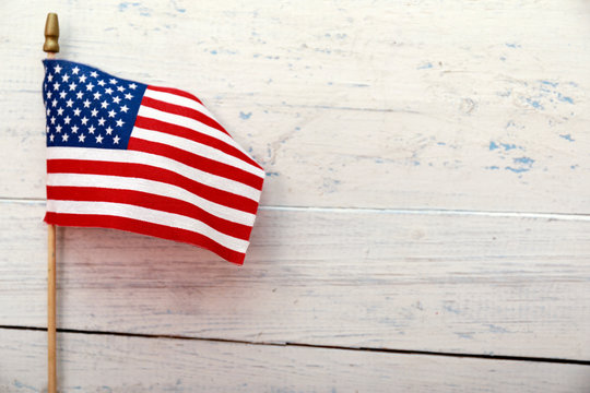 American flag on white wooden background with copy space. Memorial Day, 4th of July or Labour Day. 