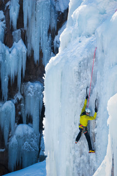 Man ice climbing in Ouray, USA