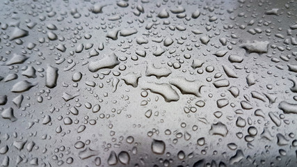 Waterdrops on a grey surface